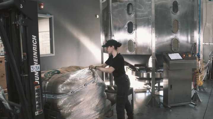 Roaster at work in a coffee roastery